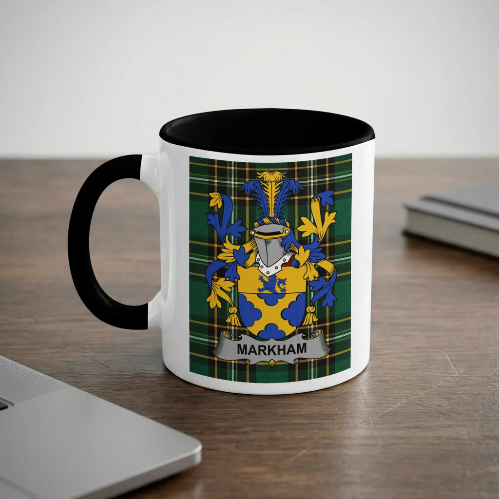 White mug with black rim featuring the Markham coat of arms on a plaid background.