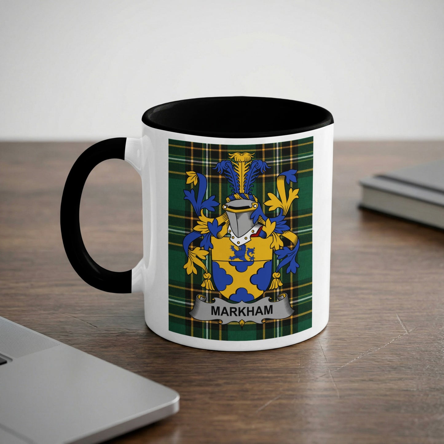 White mug with black rim featuring the Markham coat of arms on a plaid background.