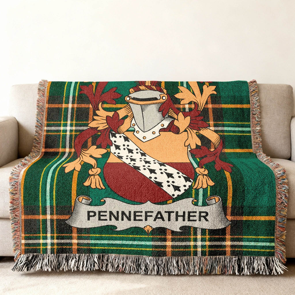 Green plaid woven throw blanket with Pennefather family crest.
