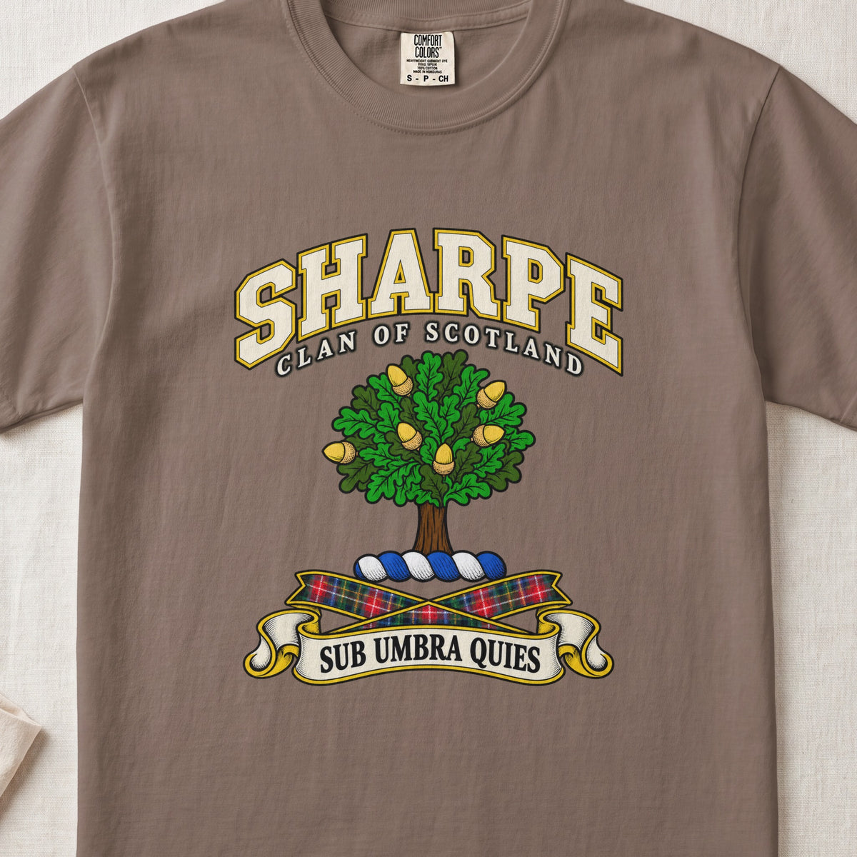 Sharpe Scottish clan T-shirt in Espresso, front view with a green tree with golden acorns and motto design.