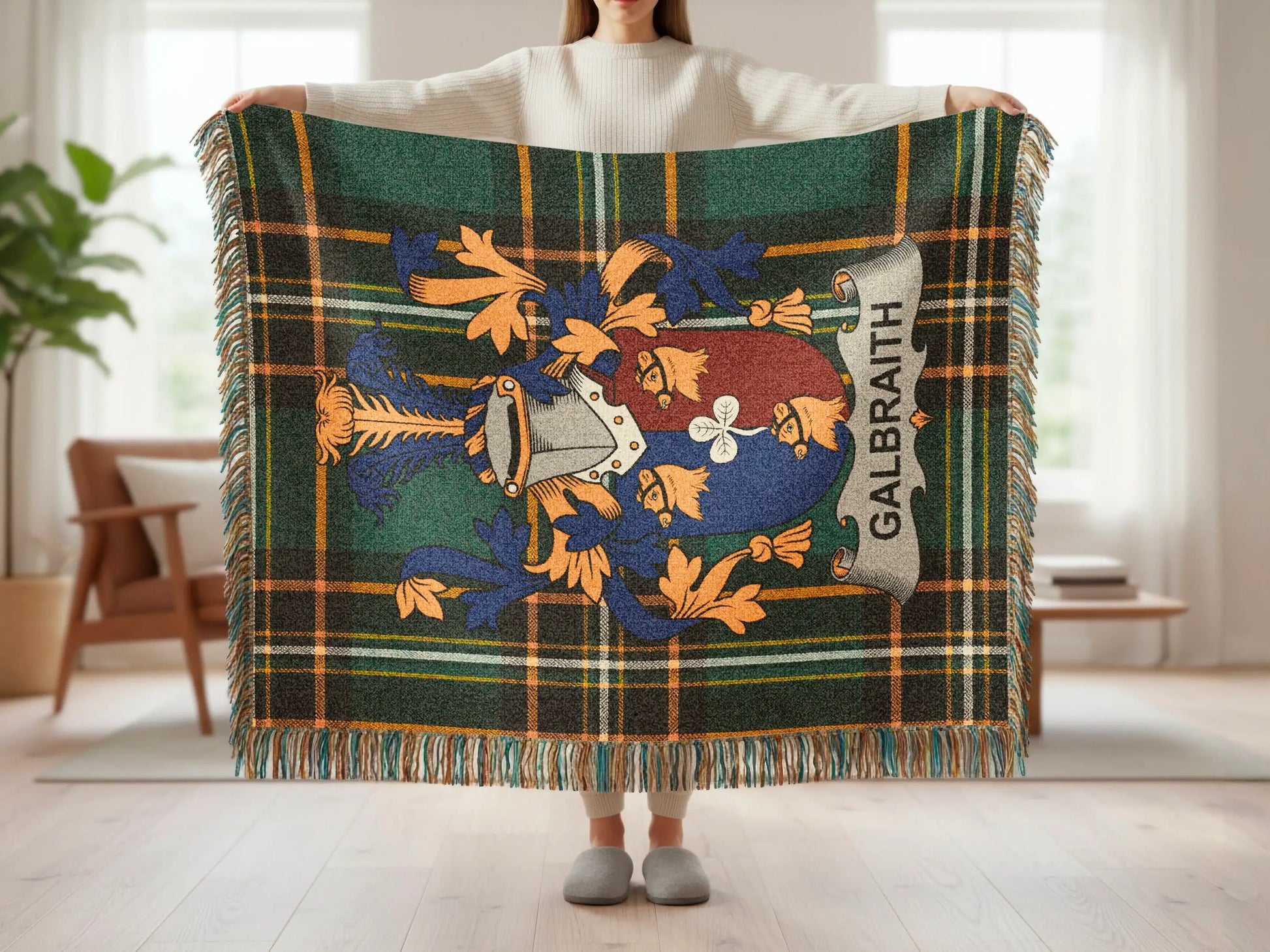 Plaid blanket with Galbraith family crest in blue, gold, and green.