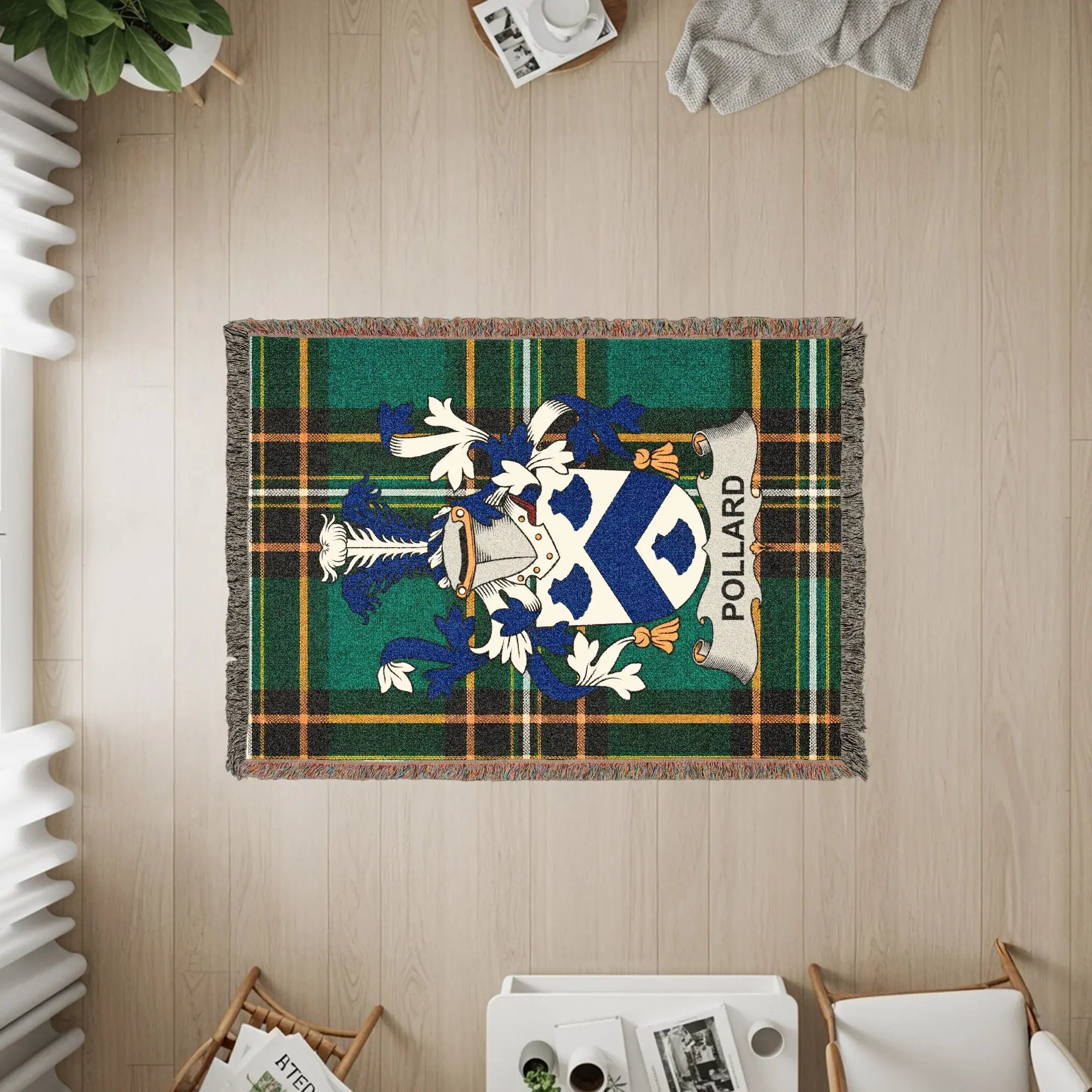 Pollard family crest on a tartan throw rug with fringe.
