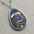 Silver necklace with tear-drop pendant featuring Weir tartan and crest with a boar.