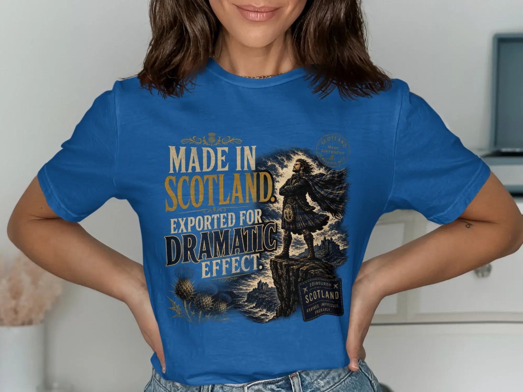Blue t-shirt with "Made in Scotland" and a Scottish warrior graphic.