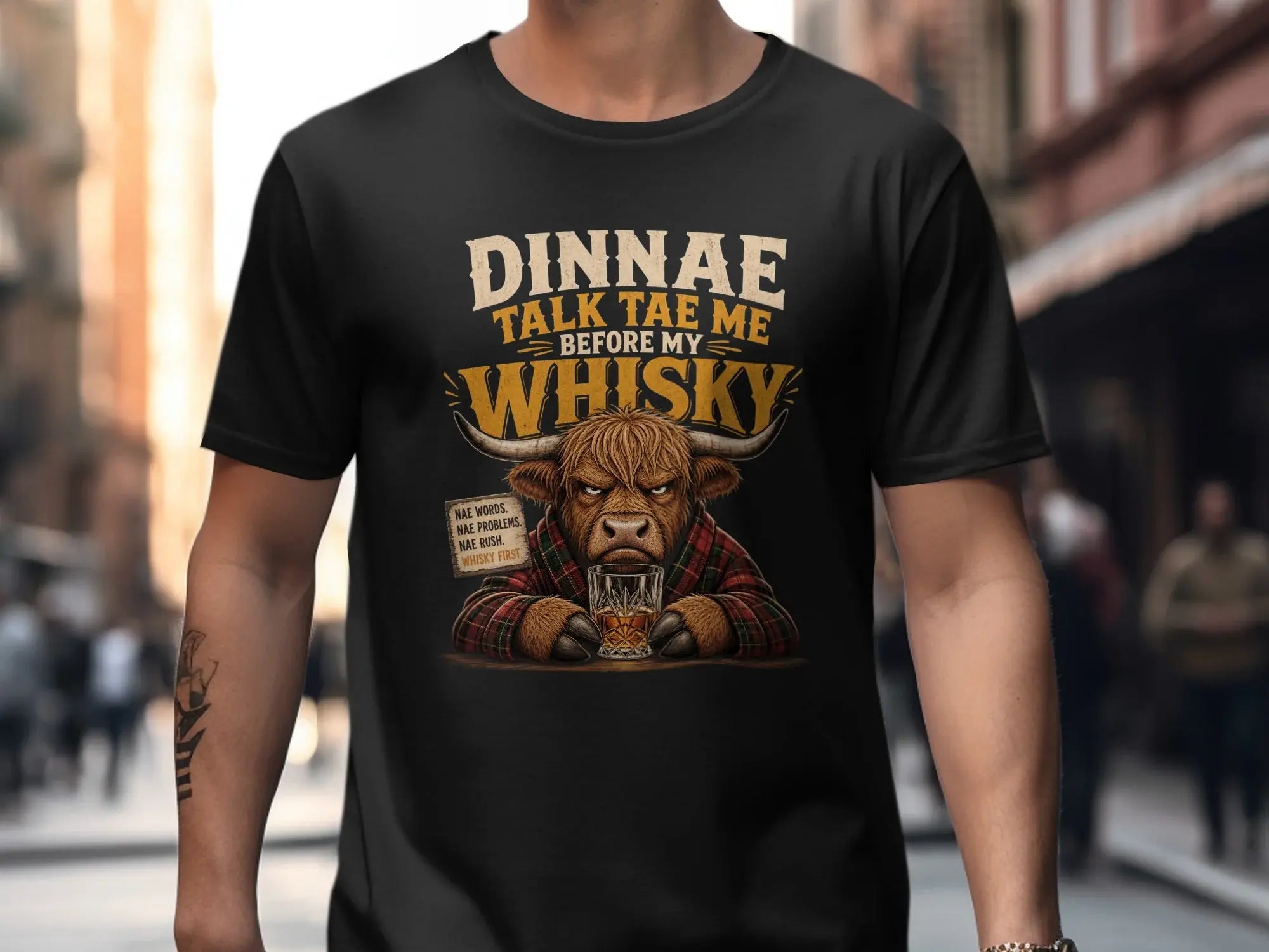 Highland cow in plaid shirt with "Dinnae talk tae me before my whisky" text.