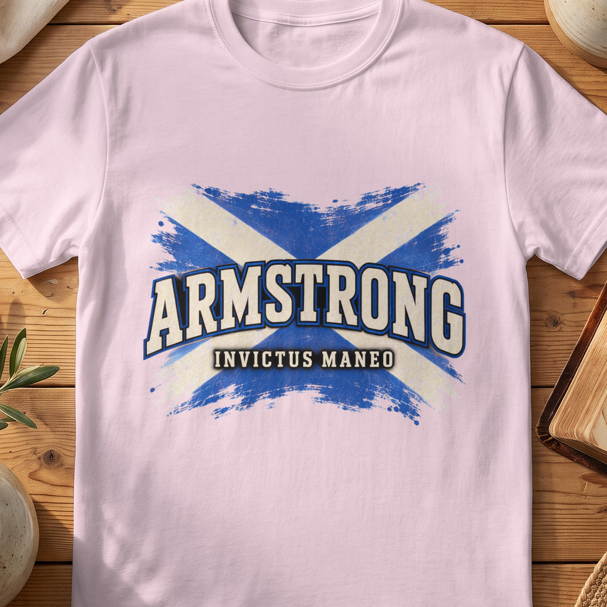 Armstrong Scottish Saltire T-shirt in Light Pink, with distressed blue and cream flag and “Invictus Maneo” lettering.