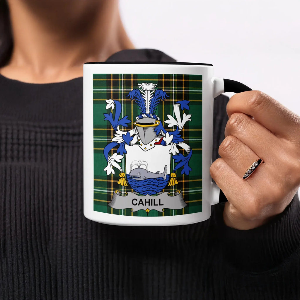 Cahill surname crest on a mug with plaid background.