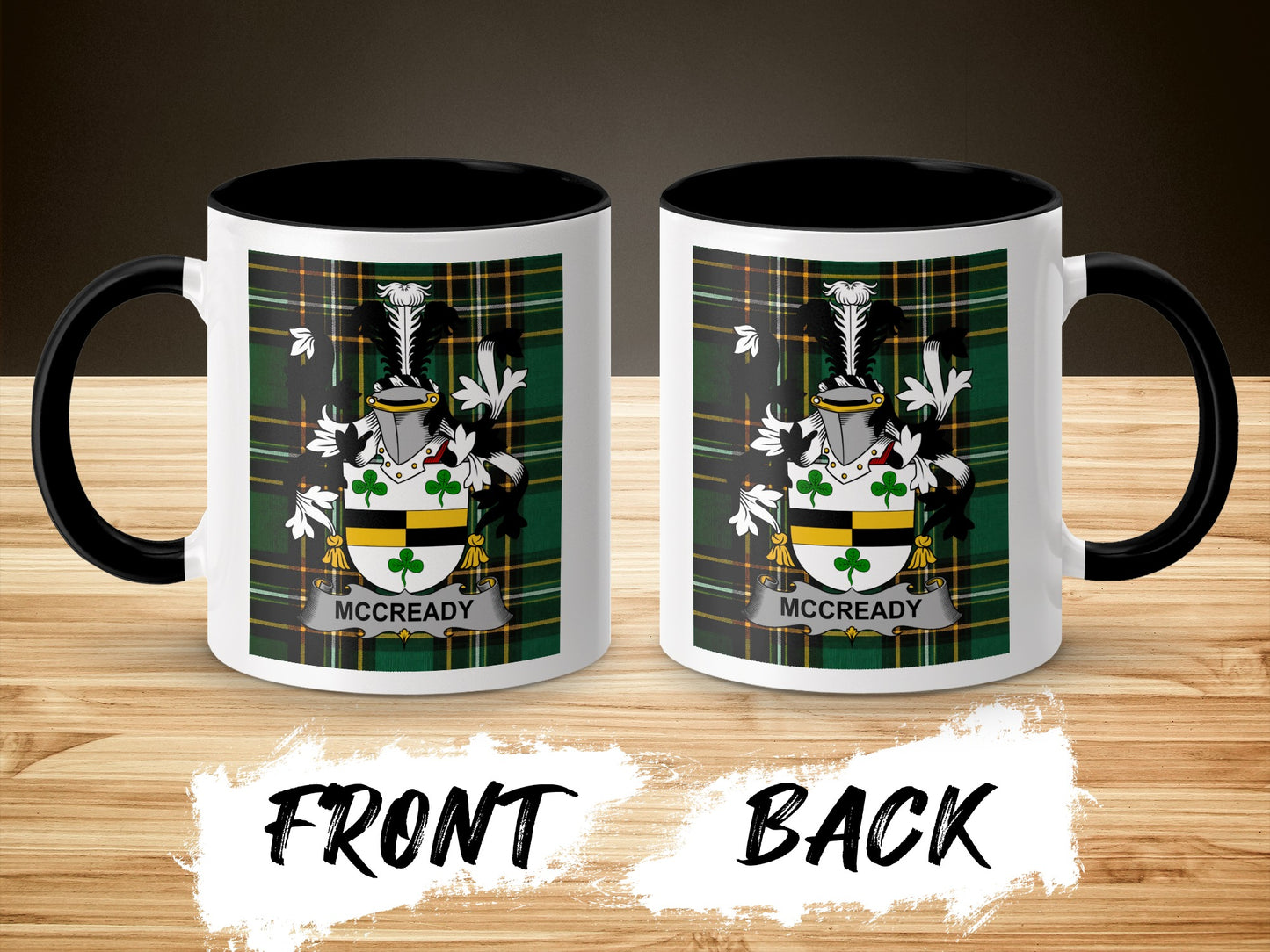 Two McCready family crests on a mug with black handle and rim.