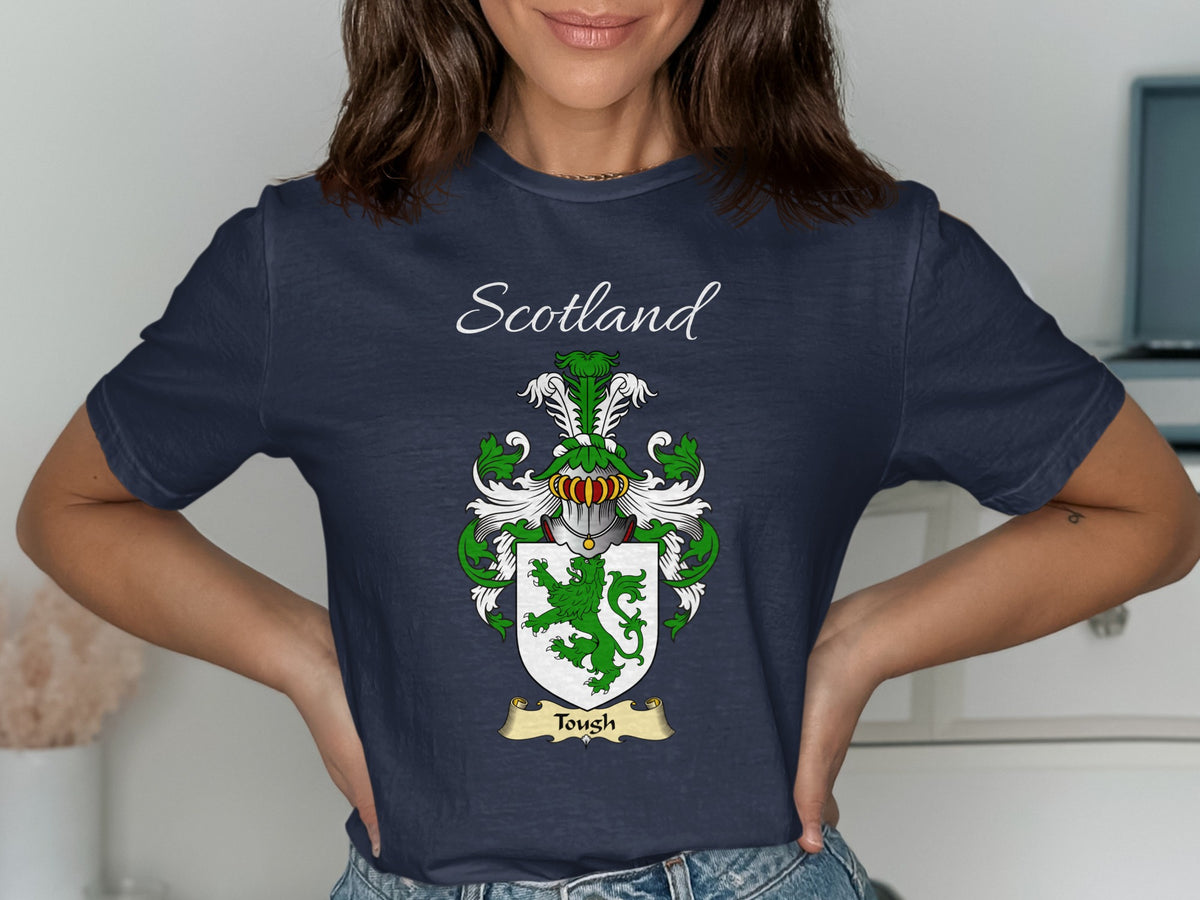 Model wearing the navy Tough family crest T-shirt featuring “Scotland” and the surname banner.