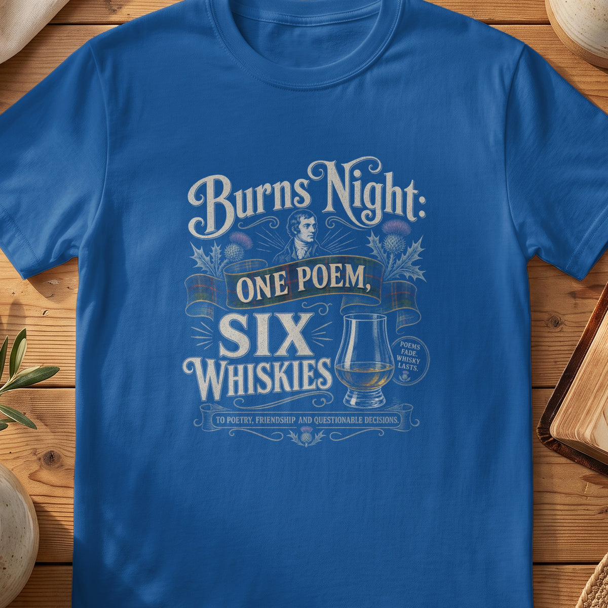 Blue t-shirt with Burns Night design featuring "One Poem, Six Whiskies".