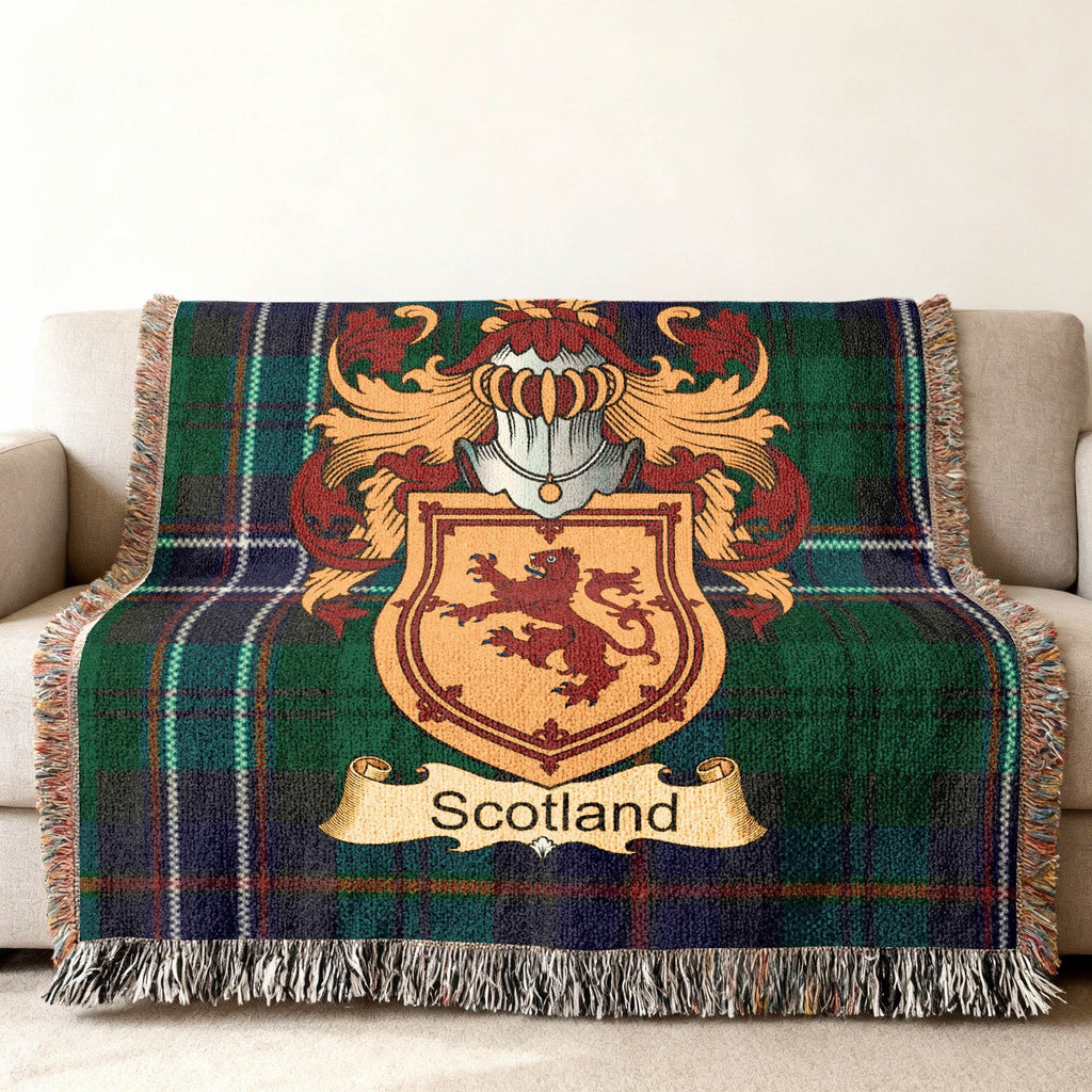 Tartan blanket with a Scottish lion rampant coat of arms and helmet.