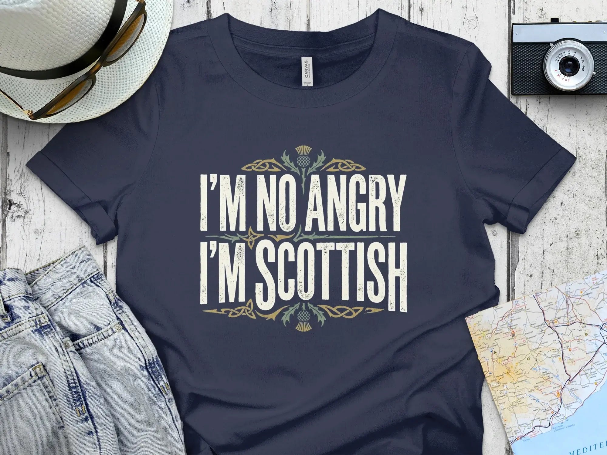 Navy t-shirt with "I'm No Angry I'm Scottish" text and thistle graphic.