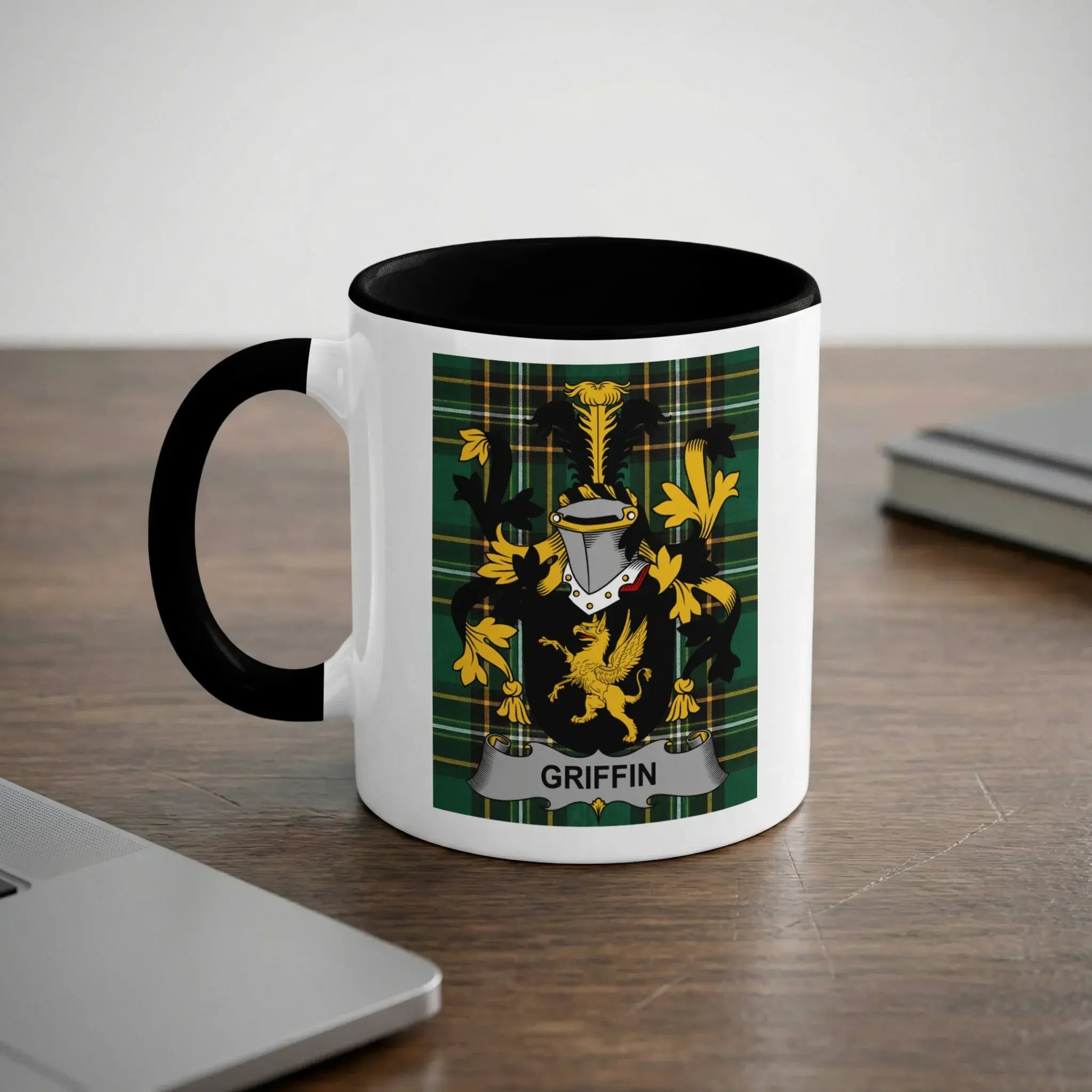Mug with black rim featuring the Griffin family crest in gold and green.