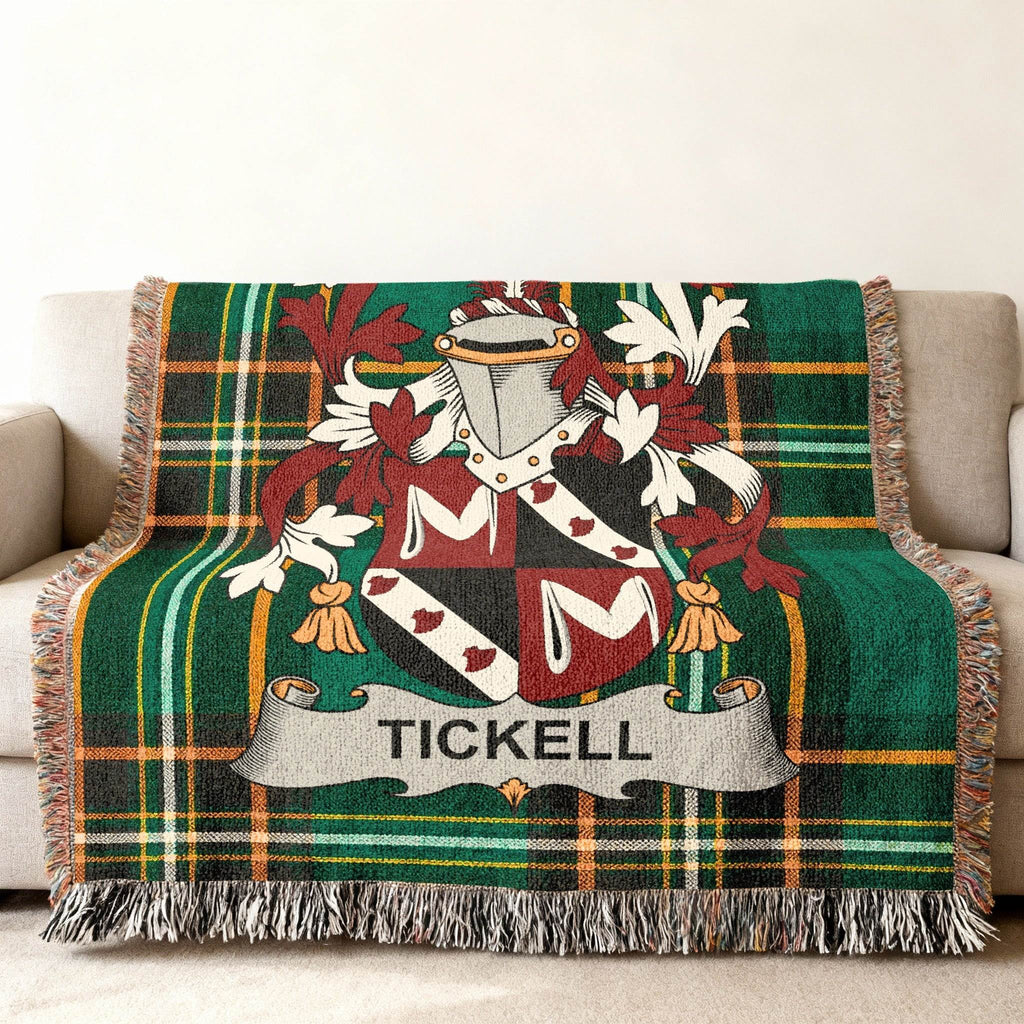 Tartan blanket with Tickell family crest in center.