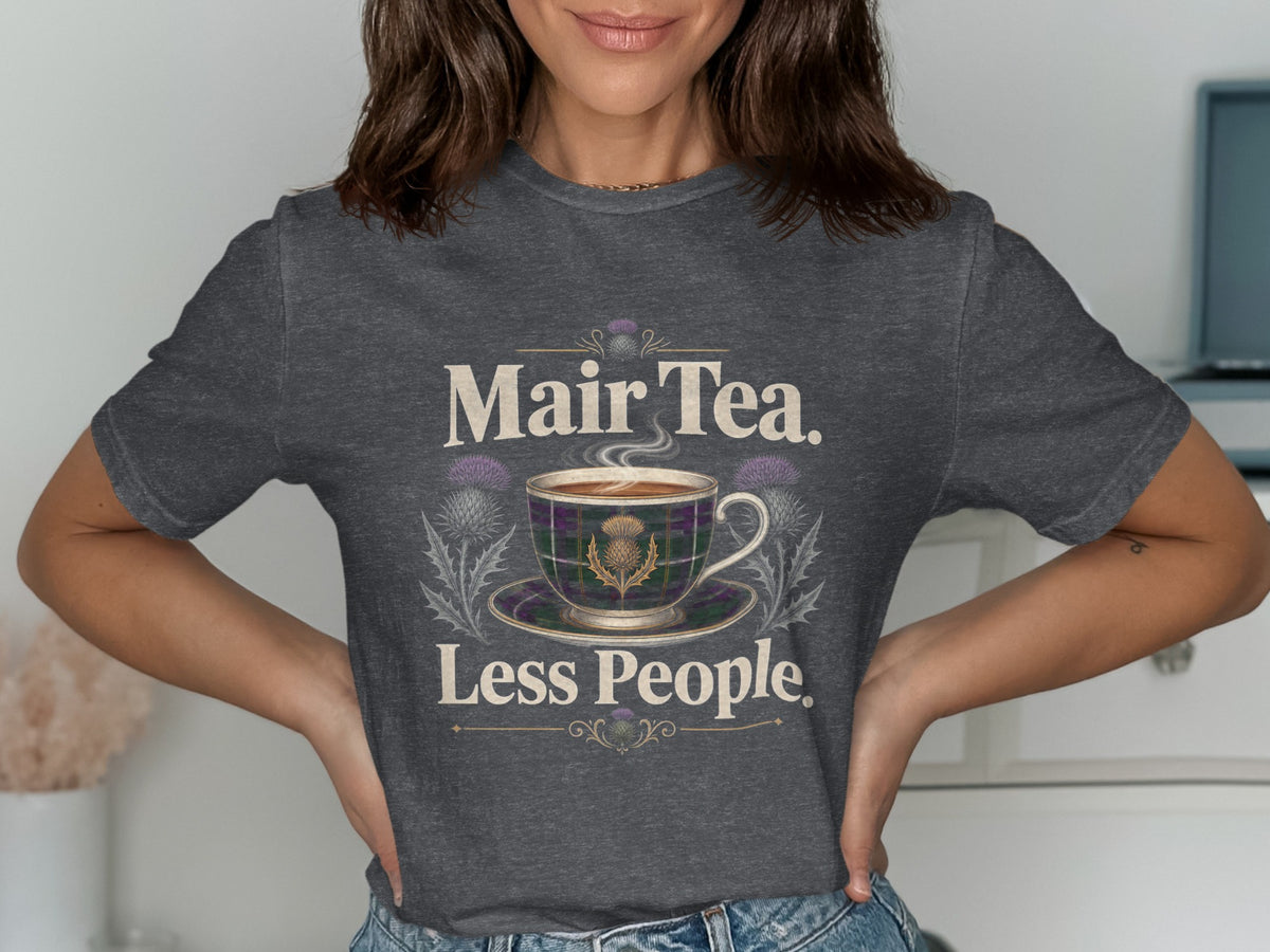 Dark grey t-shirt with "Mair Tea. Less People." text and thistle design.