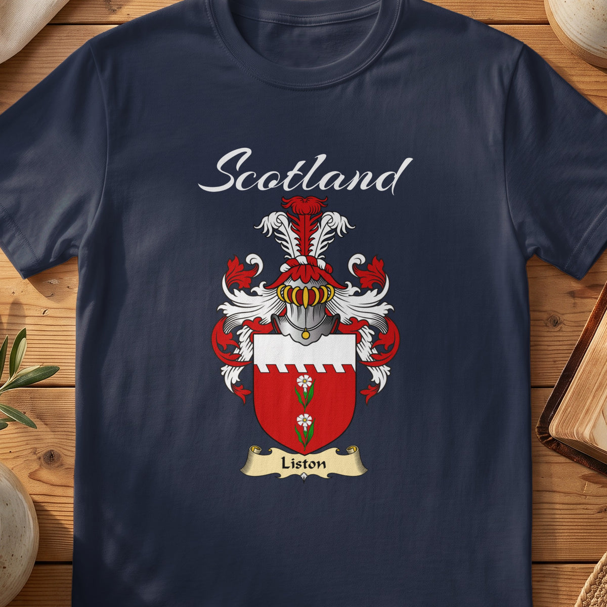 Navy Liston family shield T-shirt featuring a red shield with a white top band and green motif