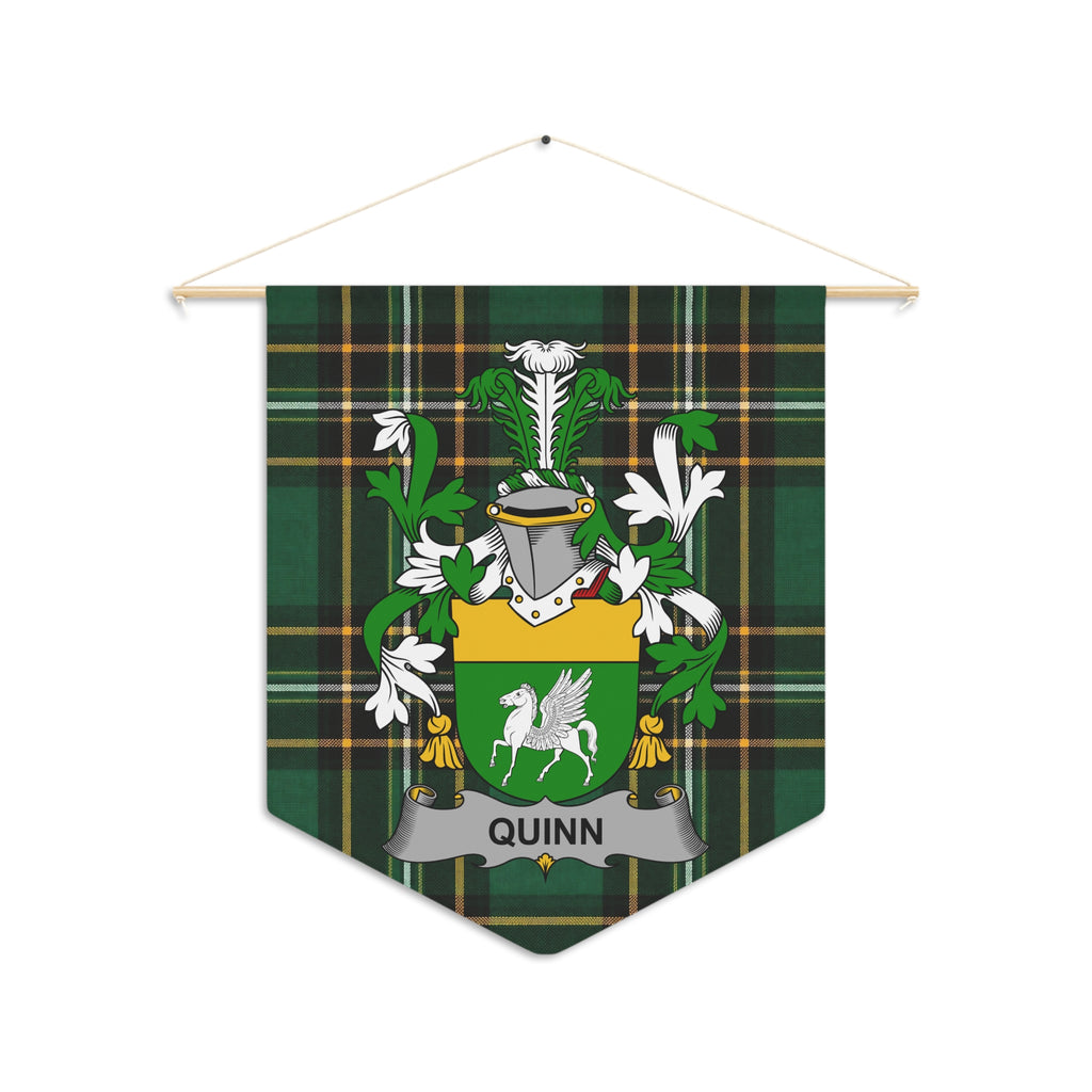 Quinn family crest on a green plaid pennant hanging from a wooden rod.