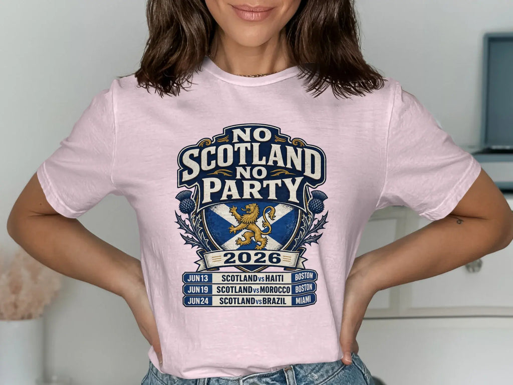 Pink t-shirt with "No Scotland Party 2026" crest and soccer match schedule.