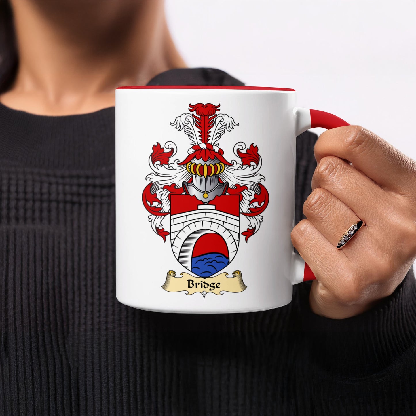 White mug with a red rim featuring a coat of arms with a bridge and the word "Bridge".