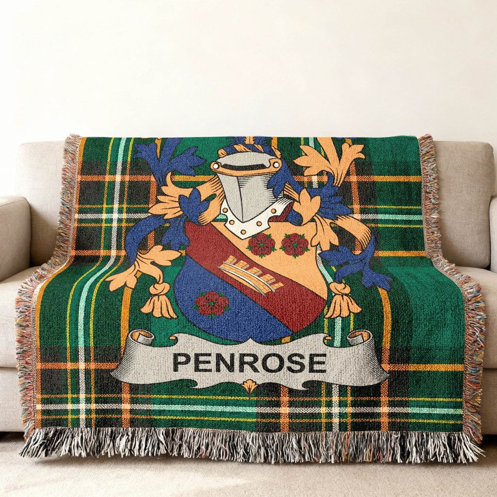 Green plaid throw blanket featuring the Penrose family crest.