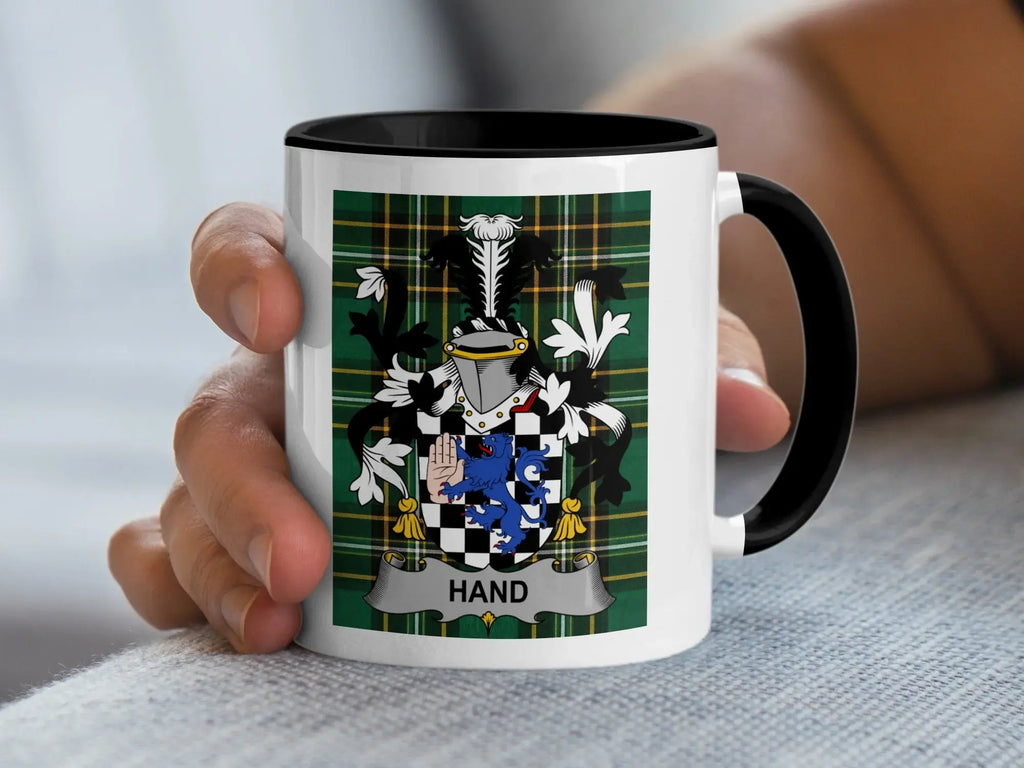 Mug with the HAND coat of arms on a tartan background.