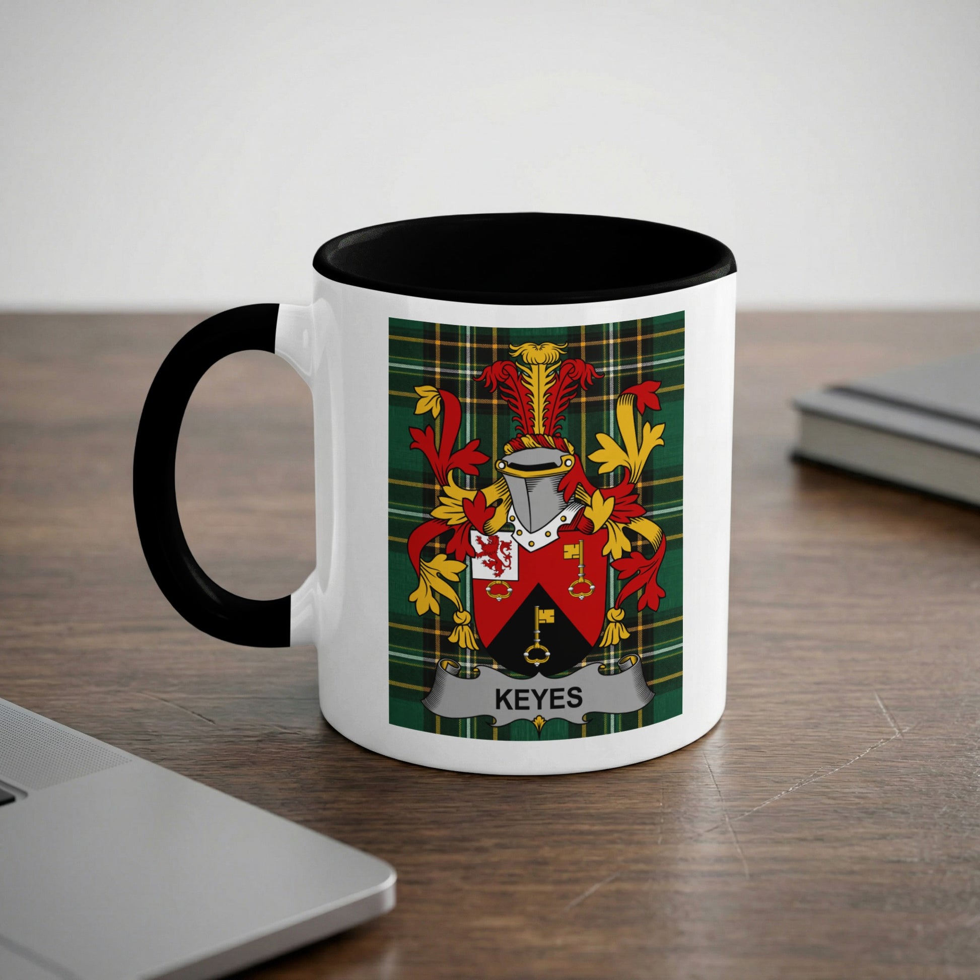 White mug with black rim featuring the Keyes family crest with a name banner.
