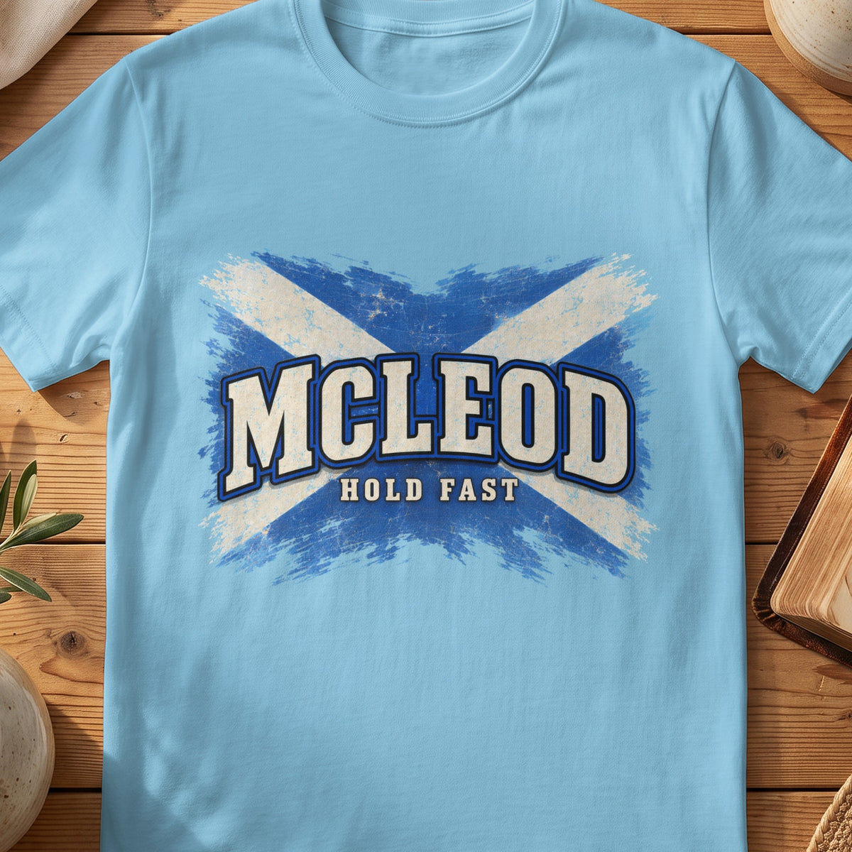 McLeod Scottish Saltire T-shirt in Sky, with distressed blue and cream flag and “Hold Fast” lettering.