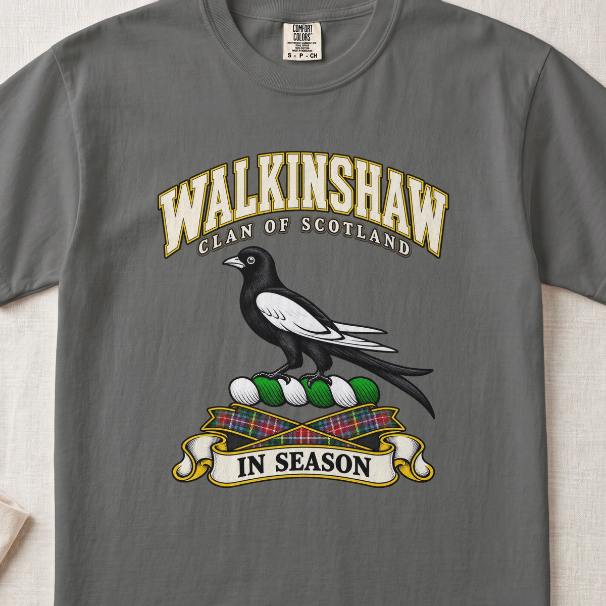 Walkinshaw Scottish clan T-shirt in Pepper, front view with a black and white magpie and motto design.