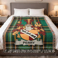 Plaid throw blanket with the Perry family crest centered on top.
