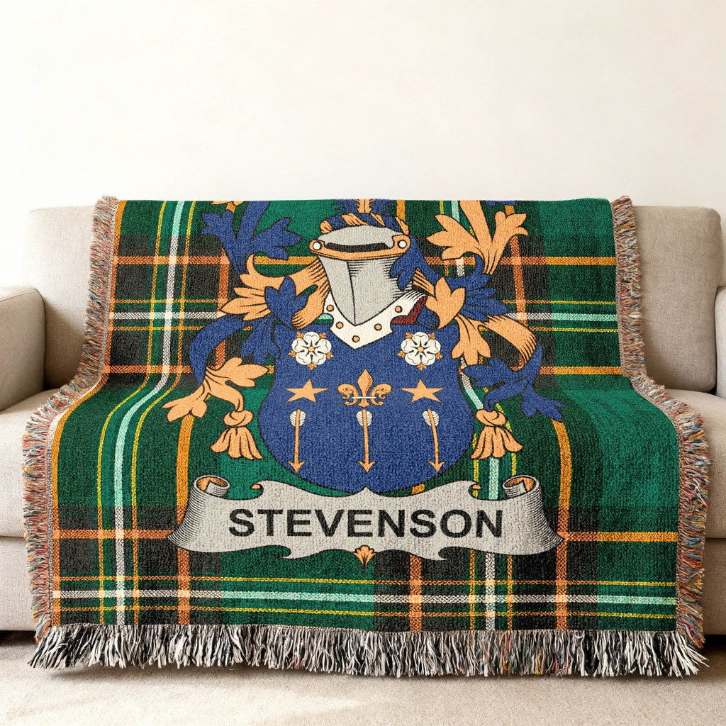 Tartan blanket with Stevenson family crest in blue, gold, and green.