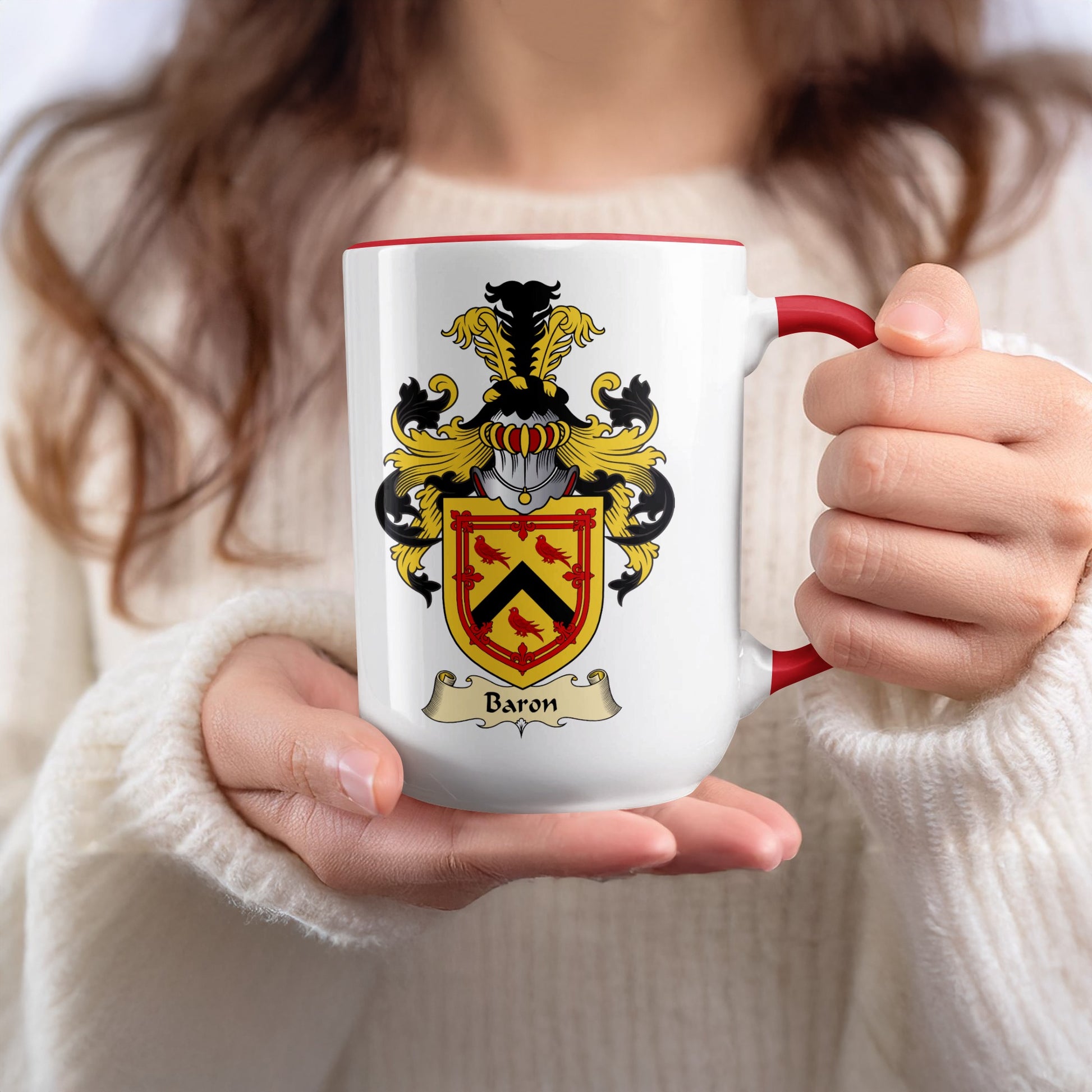 White mug with red rim and handle, featuring a coat of arms with the word "Baron".