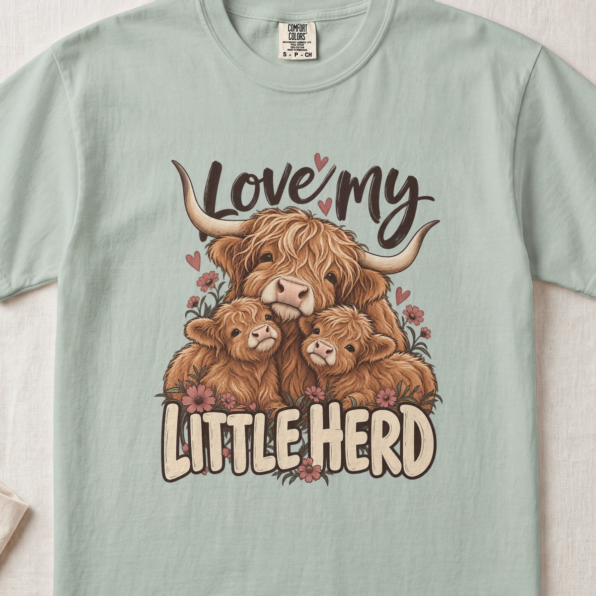 Love My Little Herd Highland cow design on a Bay Comfort Colors 1717 T-shirt, flat lay