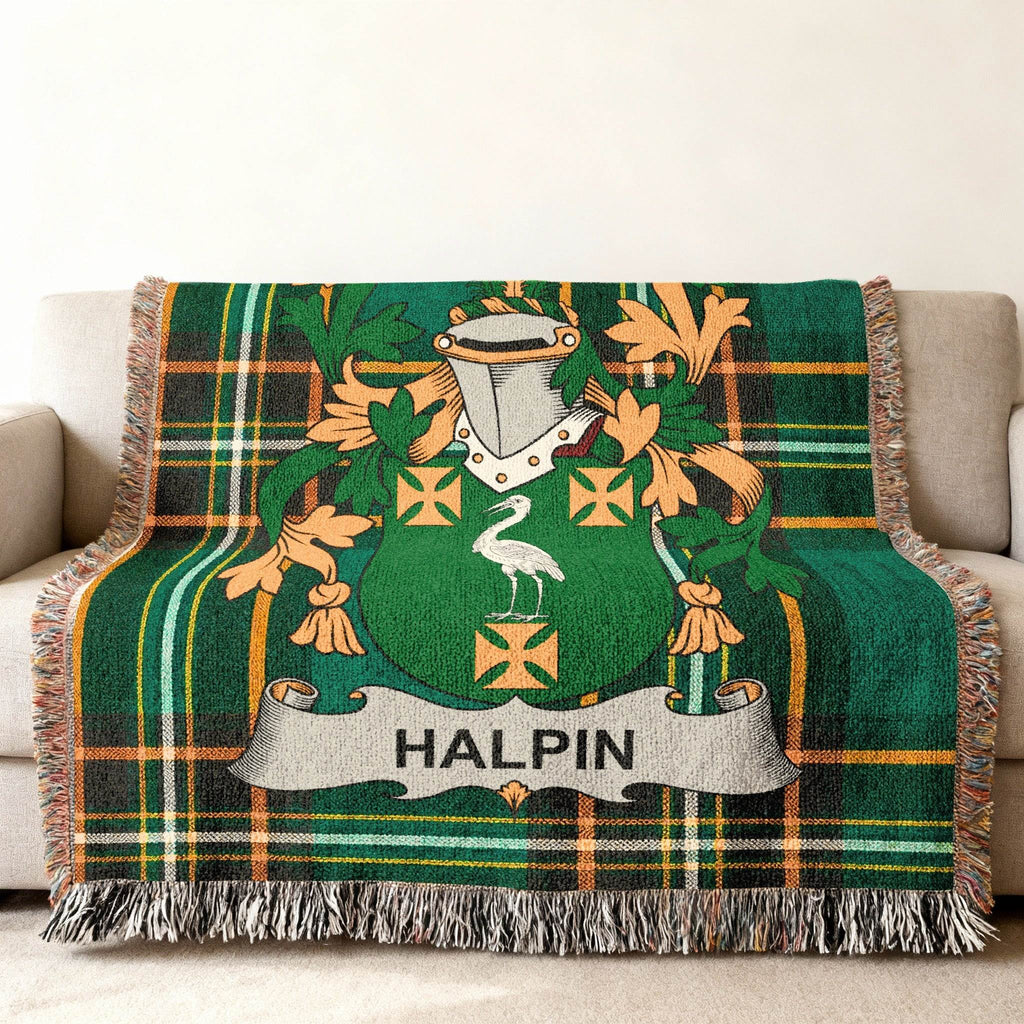 Green tartan blanket with Halpin family crest in center.