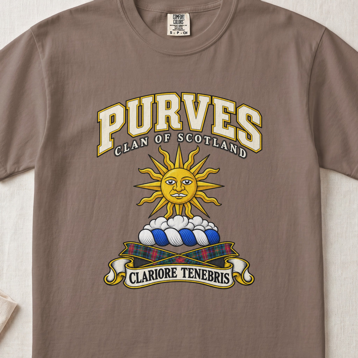 Purves Scottish clan T-shirt in Espresso, front view with a golden sun above clouds and motto design.