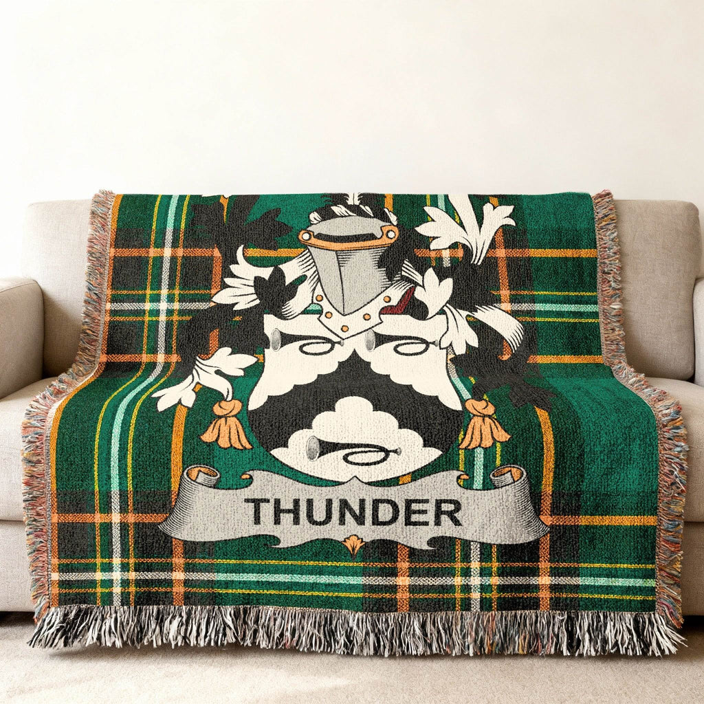 Green tartan blanket with a family crest and the word "THUNDER".