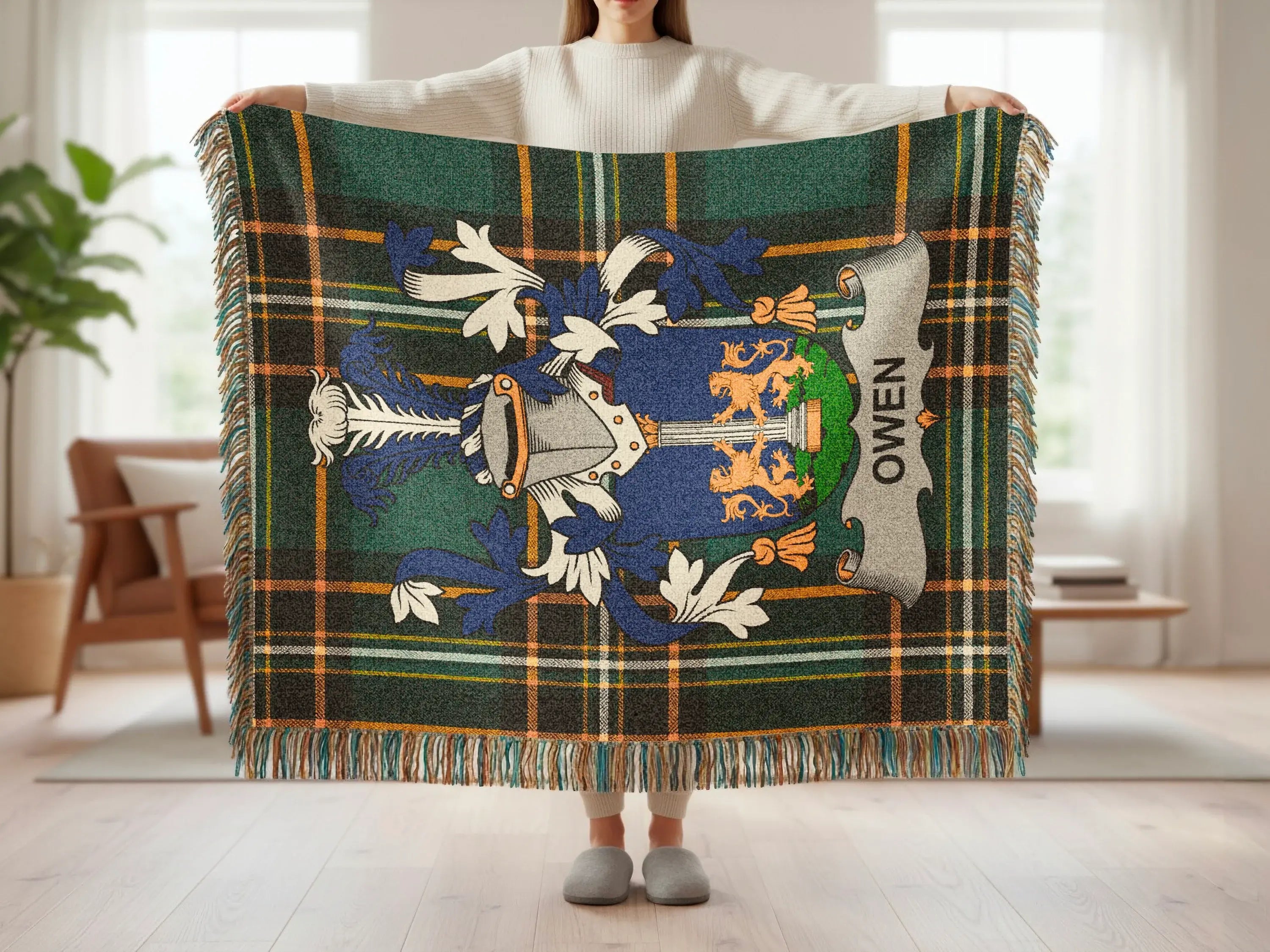 Plaid throw blanket featuring a blue and gold crest with "OWEN" text.