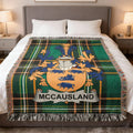 McCAUSLAND tartan blanket featuring a family crest with a boar.