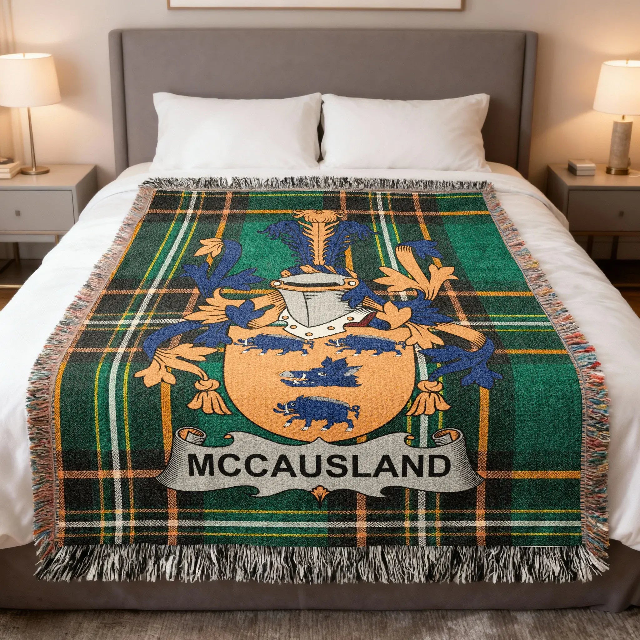 McCAUSLAND tartan blanket featuring a family crest with a boar.