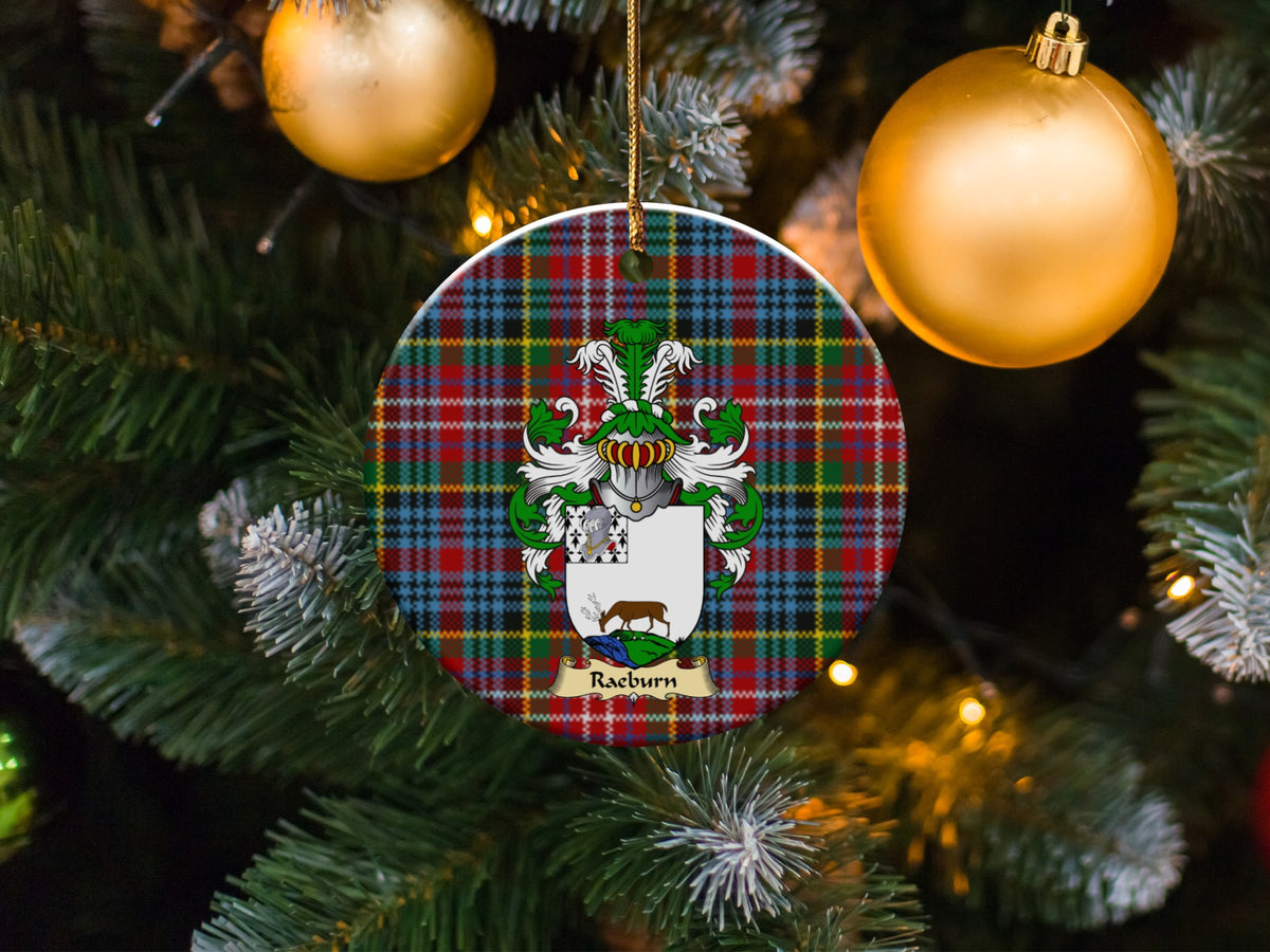 Raeburn family emblem ceramic Christmas ornament with Caledonia tartan background in festive holiday décor