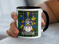 MCLYSACHT crest on white mug with black handle and rim.