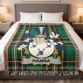 Tartan blanket with Hanna surname crest in blue, green, and white.