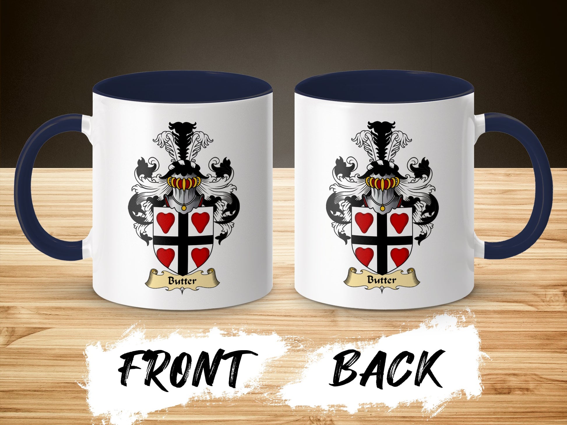 Two views of a white mug with dark blue handle, displaying a coat of arms with red hearts.