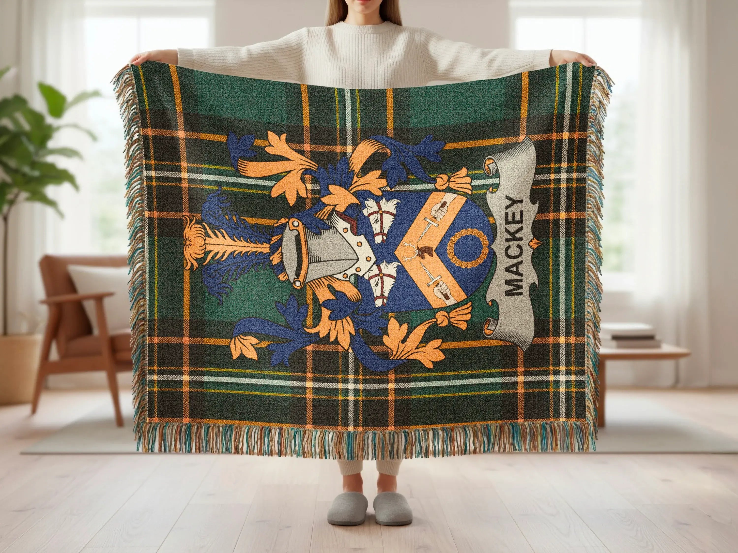 Green and blue tartan blanket with Mackey family crest.