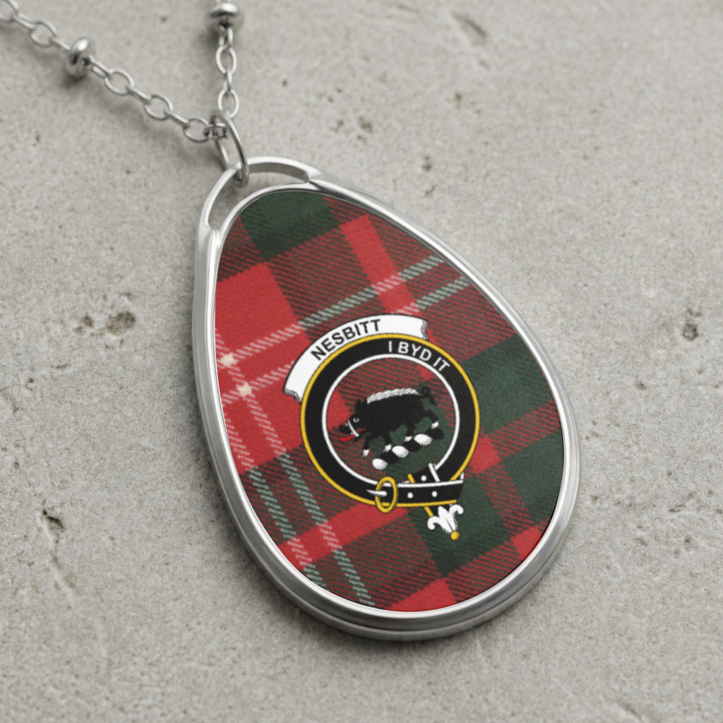 Oval pendant necklace featuring Nesbitt tartan and crest with text "I BYD IT".