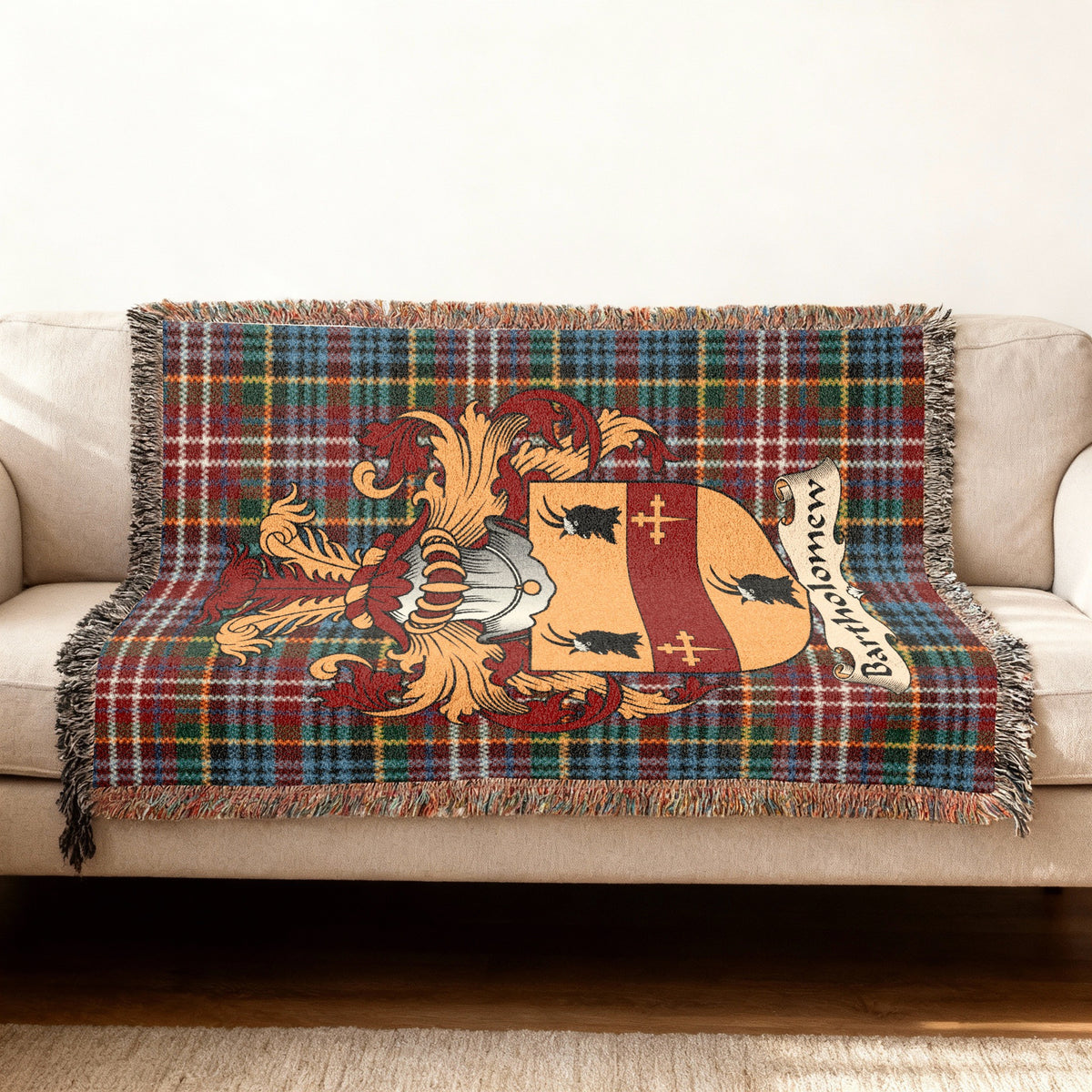 Bartholomew Scottish woven blanket with family shield and Caledonia tartan background