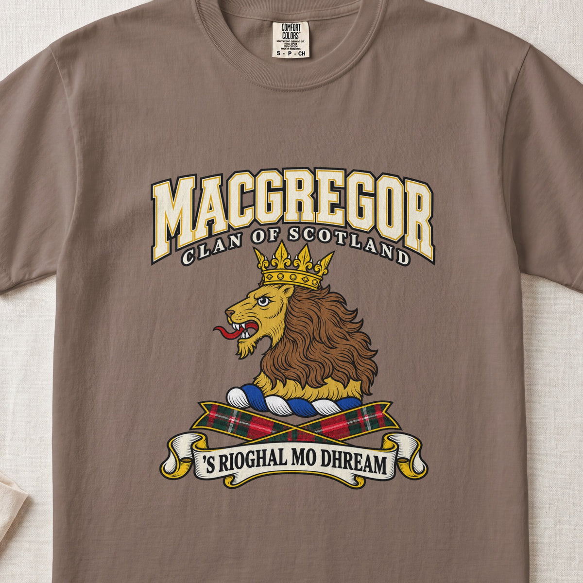 MacGregor graphic T-shirt in Espresso brown, front flat lay showing varsity lettering and gold lion head with brown mane and gold crown.