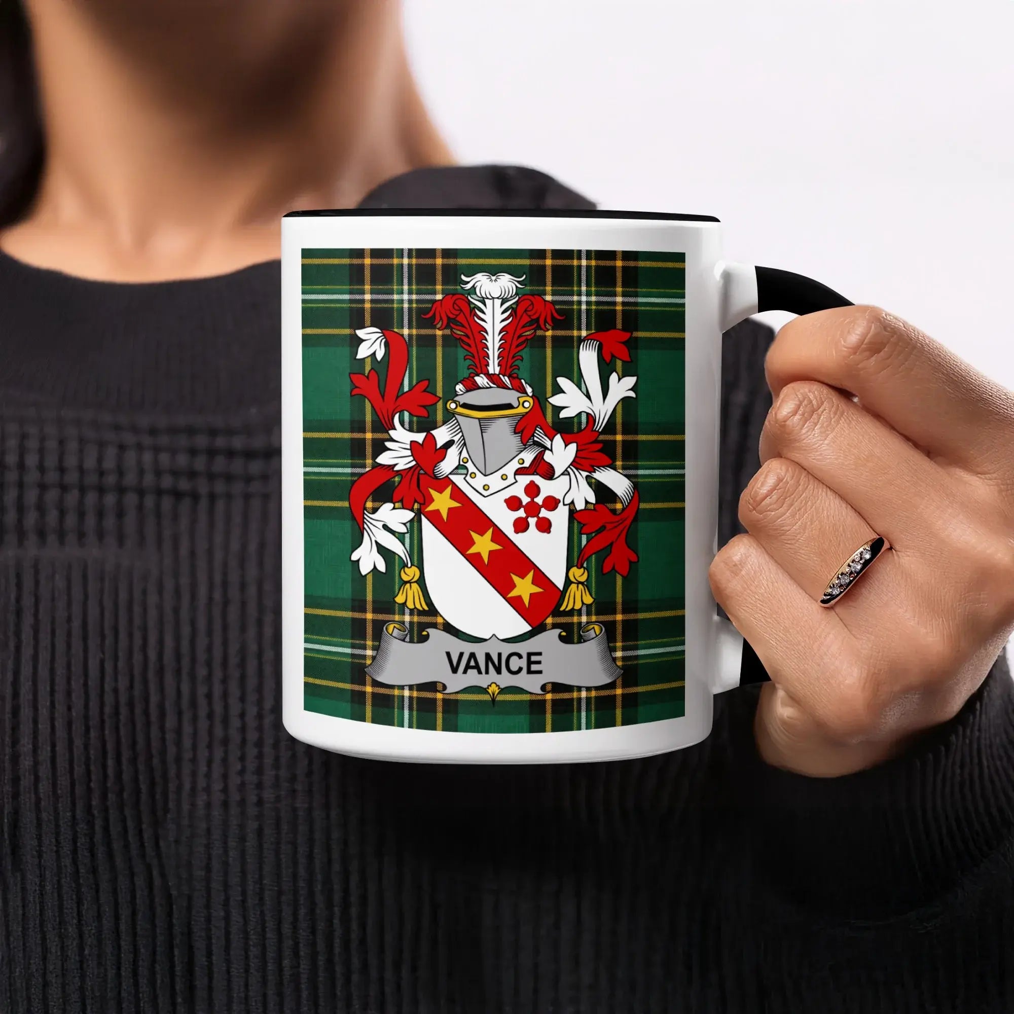 Mug featuring a family crest with the name "Vance" on a plaid background.
