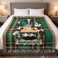 Tartan blanket with MARGETSON family crest on a bed.