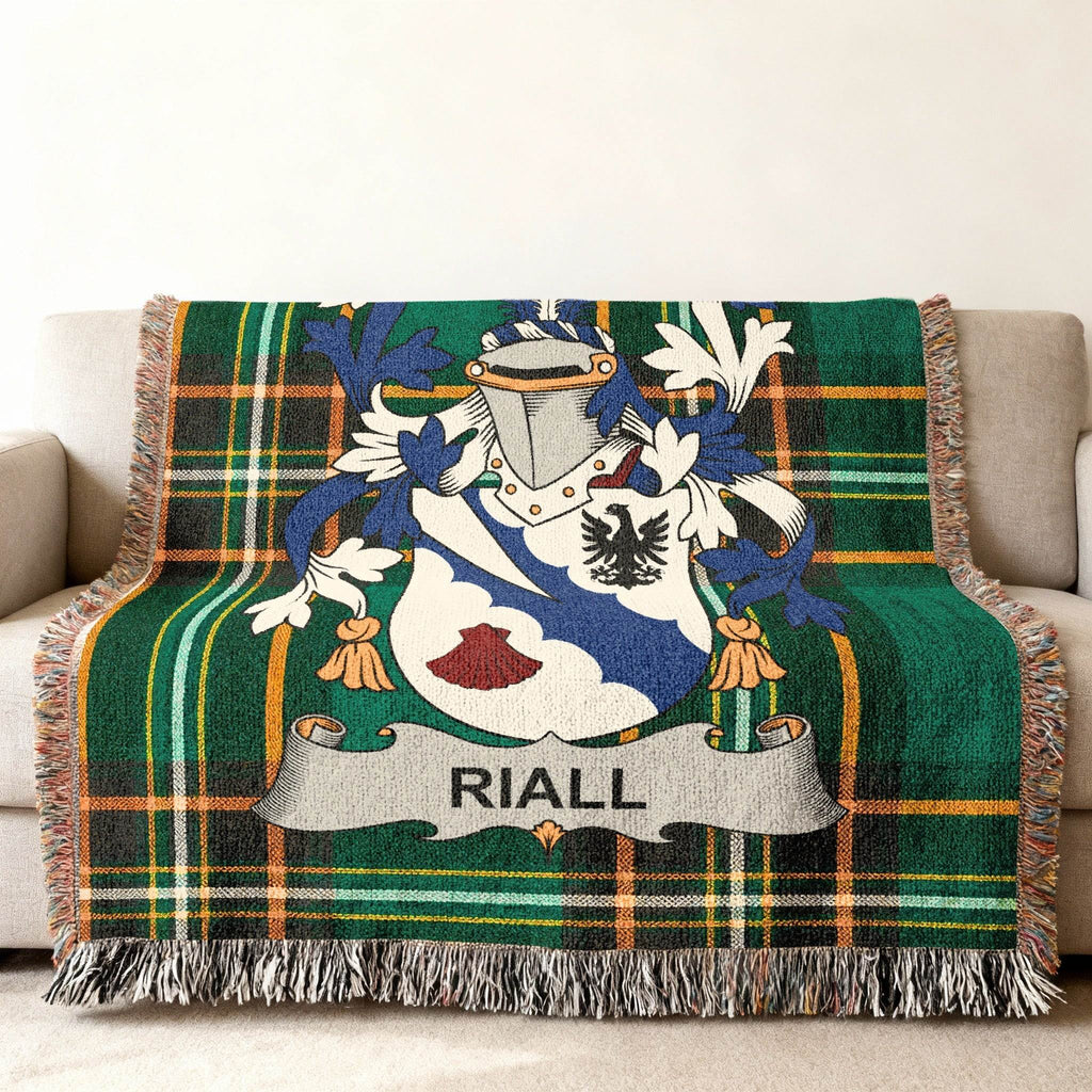 Green tartan throw blanket with Riall family crest.