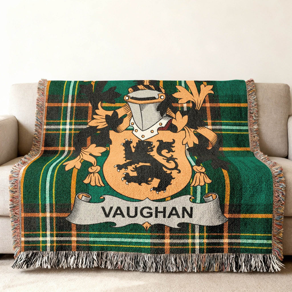 Green tartan blanket featuring the Vaughan family crest with a lion and shield.
